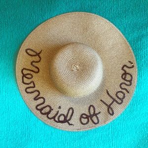 “Mermaid of honor” floppy straw look hat.